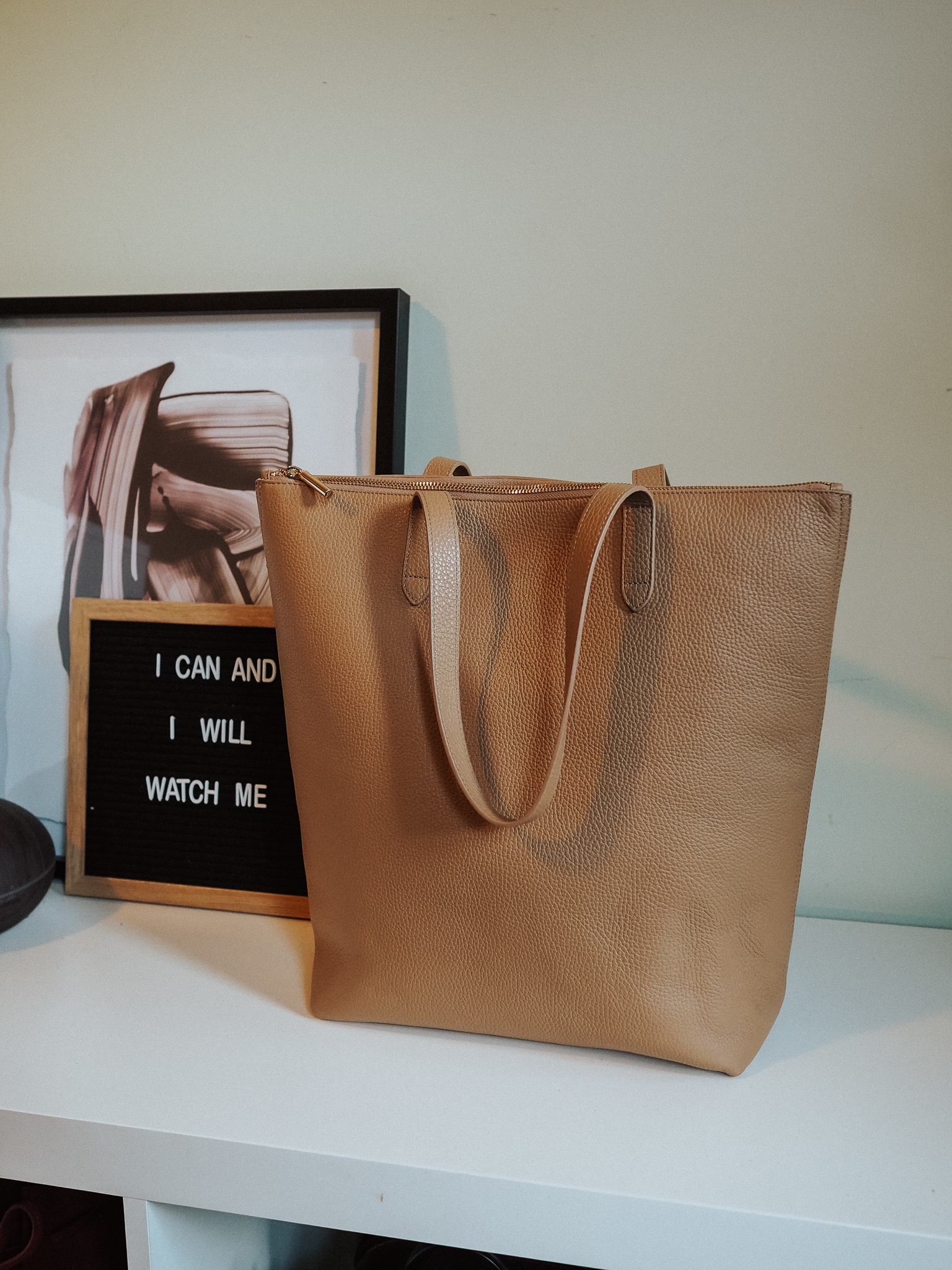 Trying to choose the best Cuyana leather tote? Look no further than the Tall Structured Zipper Tote in this blog post review.