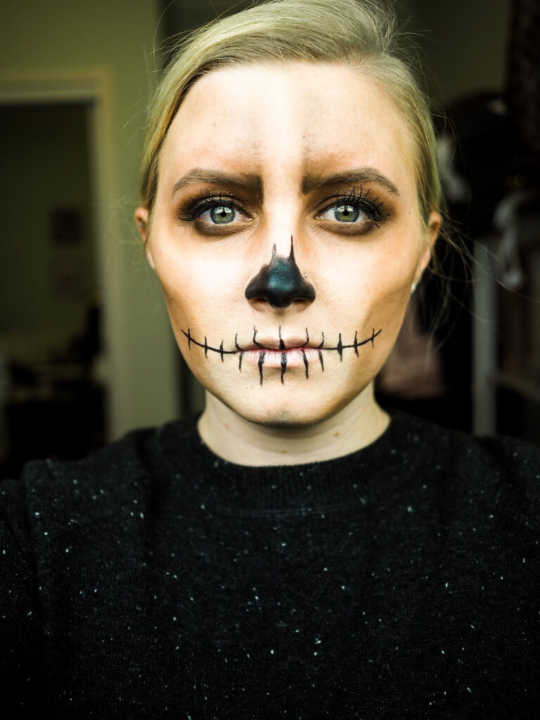 Hard up for a costume this year? This easy skeleton makeup for Halloween is easy to execute - but looks cool AF. 